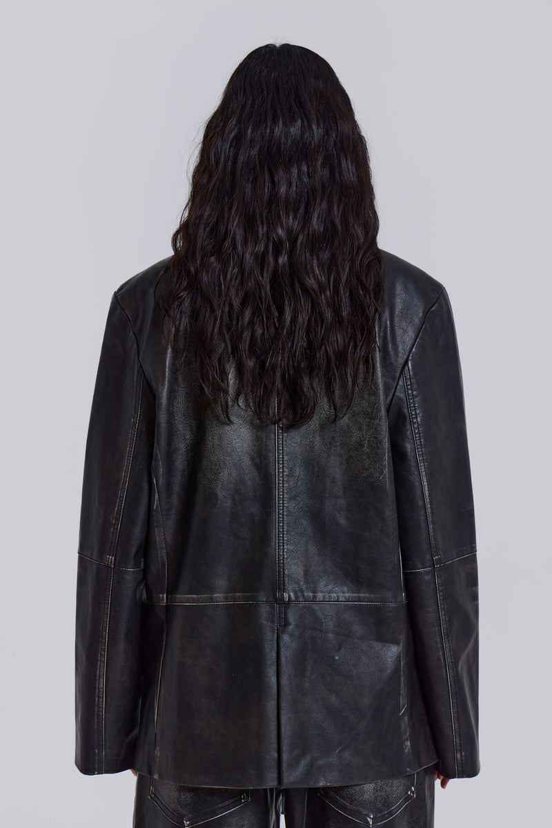 Introducing the Ash Blazer - crafted from a faux leather PU fabric with a unique heavy acid wash finish in an off-black colourway, this oversized fit blazer features a two-button front, jet pockets with flaps on the chest and a back vent, the blazer is fully lined and perfect for layering.
